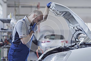 Professional mechanic doing a car inspection