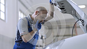 Professional mechanic doing a car inspection