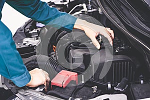 Professional mechanic hand providing car repair and maintenance service