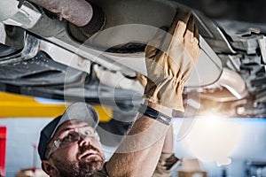 Professional Mechanic Performing Car Catalytic Converter Check