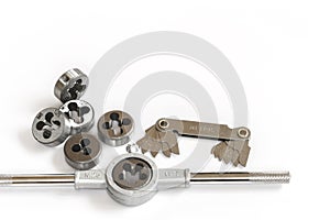 Professional mechanical hand tool set . Tap and die nuts for metal work.