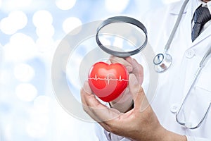 Professional medical doctor holding a magnifying glass check up