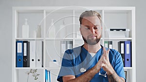 Professional medical doctor in hospital office, Portrait of young and confident physician.