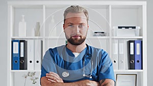 Professional medical doctor in hospital office, Portrait of young and confident physician.