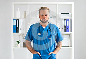 Professional medical doctor in hospital office, Portrait of young and confident physician.