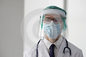 Professional medical doctor in hospital office. Portrait of young and confident physician. Medical concept.