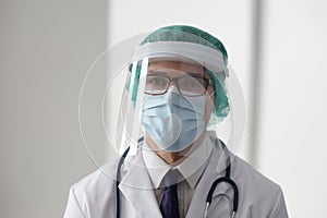 Professional medical doctor in hospital office. Portrait of young and confident physician. Medical concept.