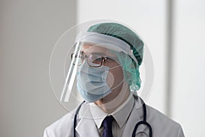 Professional medical doctor in hospital office. Portrait of young and confident physician. Medical concept.