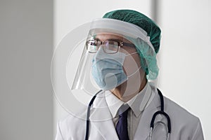 Professional medical doctor in hospital office. Portrait of young and confident physician. Medical concept.