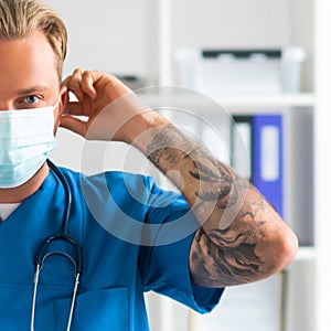 Professional medical doctor in hospital office, Portrait of young and confident physician in protective mask.