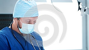 Professional medical doctor working in emergency medicine. Portrait of the surgeon in protective mask.