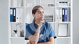 Professional medical doctor working in hospital office, Portrait of young and attractive female physician.