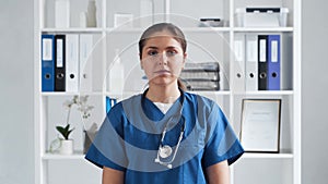 Professional medical doctor working in hospital office, Portrait of young and attractive female physician.