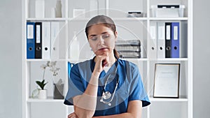 Professional medical doctor working in hospital office, Portrait of young and attractive female physician.