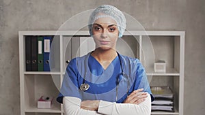 Professional medical doctor working in hospital office, Portrait of young and attractive female physician in protective