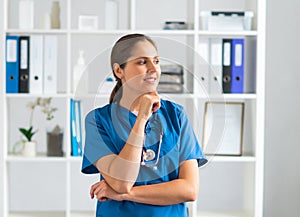 Professional medical doctor working in hospital office, Portrait of young and attractive female physician in protective