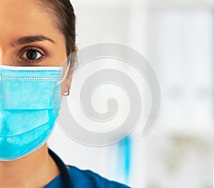 Professional medical doctor working in hospital office, Portrait of young and attractive female physician in protective