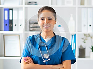 Professional medical doctor working in hospital office, Portrait of young and attractive female physician in protective