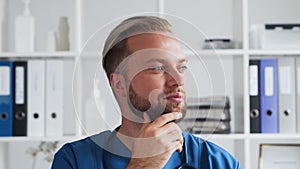 Professional medical doctor working in hospital office, Portrait of young and confident physician.