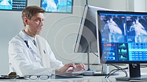 Professional medical doctor working in hospital office using computer technology. Medicine, cardiology and healthcare.