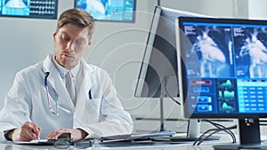 Professional medical doctor working in hospital office using computer technology. Medicine, cardiology and healthcare.