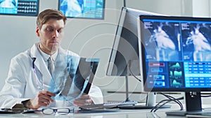 Professional medical doctor working in hospital office using computer technology. Medicine, cardiology and healthcare.