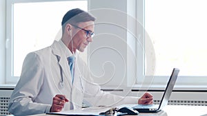 Professional medical doctor working in hospital office using computer technology. Medicine and healthcare.