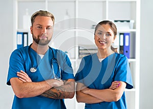 Professional medical doctors working in hospital office, Portrait of young and confident physicians.