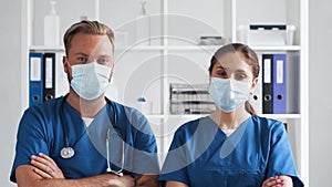 Professional medical doctors working in hospital office, Portrait of young and confident physicians in protective masks.