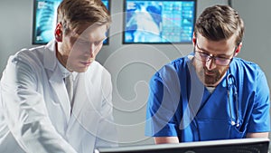 Professional medical doctors working in hospital office using computer technology. Medicine, cardiology and healthcare.