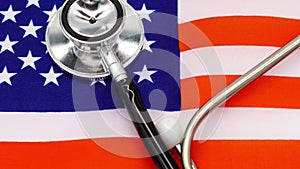 Professional Medical Stethoscope on the Vibrant American Flag - A Symbol of the Nationâ€™s Healthcare System and Medical