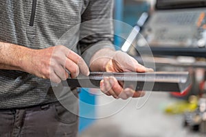 Professional metalworker at the manufacture workshop