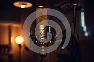 Professional microphone on stand in recording studio, closeup