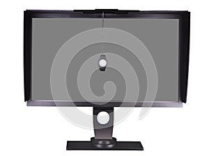 Professional monitor with shading hood and calibrator isolated on white