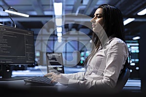 IT professional monitoring and maintaining servers in data center