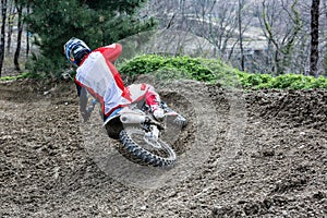 Professional Motocross Motorcycle Rider Drives Over the Road Track.