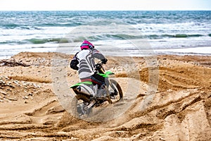 Professional Motocross Motorcycle Rider Drives Over the Road Track.