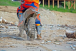 Professional Motocross Motorcycle Rider Drives Over the Road Track.