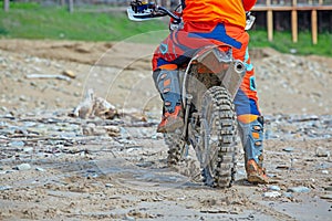 Professional Motocross Motorcycle Rider Drives Over the Road Track.