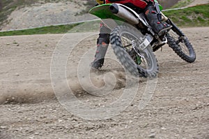 Professional Motocross Motorcycle Rider Drives Over the Road Track.