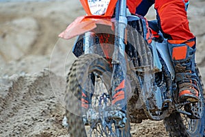 Professional Motocross Motorcycle Rider Drives Over the Road Track. clouse up