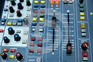 A professional music console called an audio mixer used to publicize concerts and other music events.