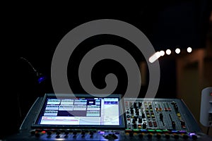 A professional music console called an audio mixer used to publicize concerts and other music events.