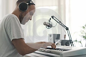 Professional musician playing and composing music at home