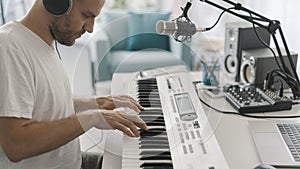 Professional musician playing and composing music at home