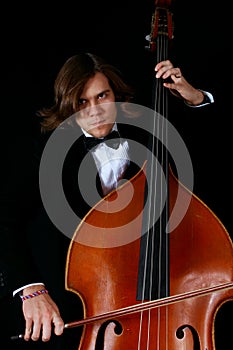 Professional musician playing on a contrabass photo