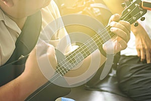 Professional Musician Playing Modern Ukulele Guitar in the Party