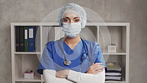 Professional Muslim medical doctor works in hospital office. Young and attractive Middle Eastern female physician in