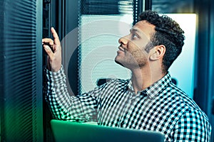 Professional nice man checking the server system