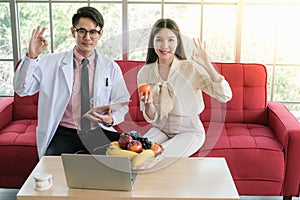 Professional nutritionist asian man consulting asia woman in clinic or hospital or medical club